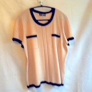 Pale pink with black trim.  Karl Lagerfeld XL blouse.